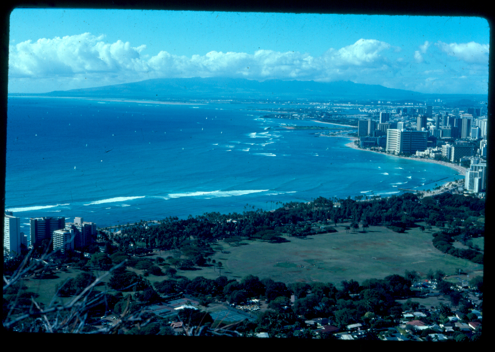 Honolulu coastline and blue water seen from above